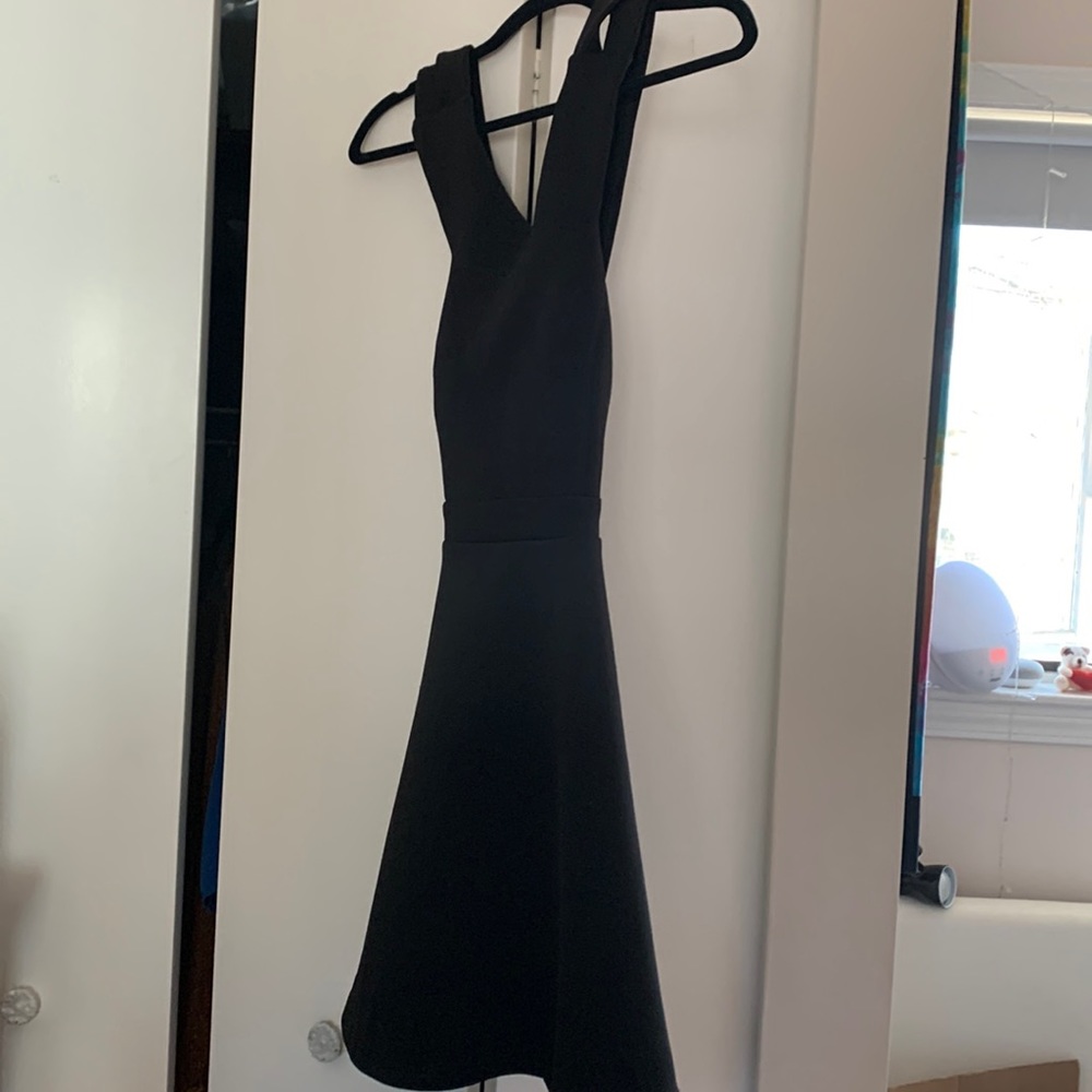 Trac, black dress with a double cross back. Thick cotton material. Like new